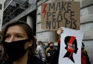 People take part in a protest against the ruling by Poland's Constitutional Tribunal that imposes a near-total ban on abortion in Warsaw