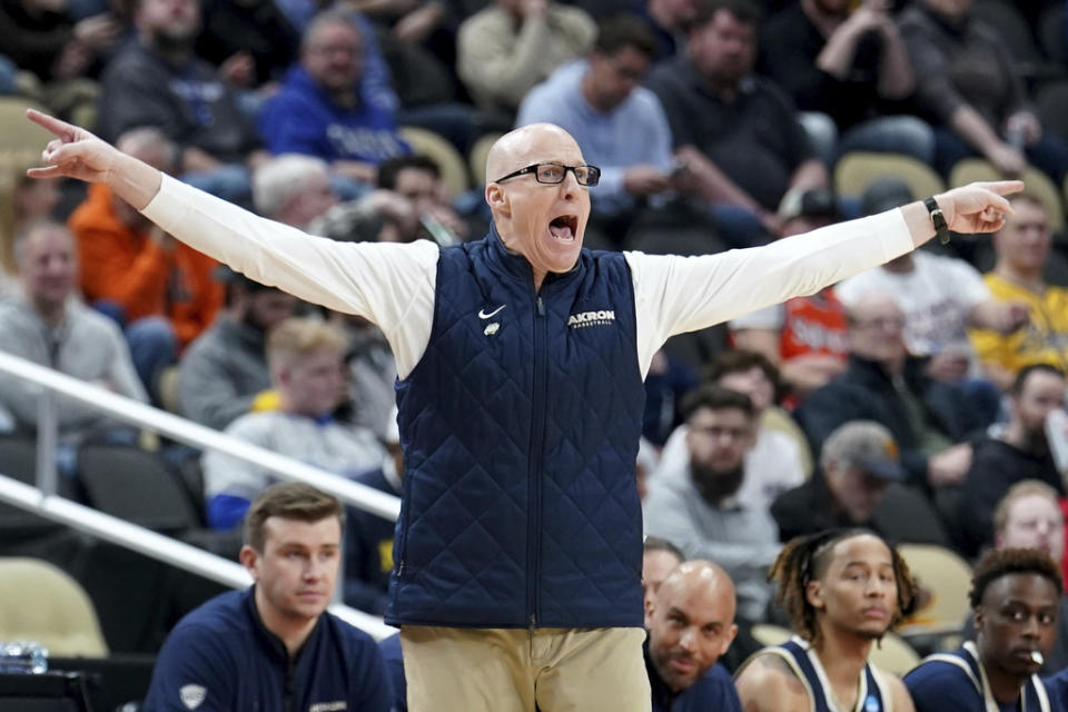 Akron head coach John Groce calls out to his team during the first half of a college basketball game against Creighton in the first round of the NCAA men’s tournament Thursday, March 21, 2024, in Pittsburgh. (AP Photo/Matt Freed)