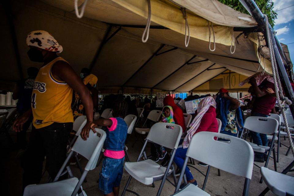 Expelled migrants arrive on September 19, 2021 at the airport in Port au Prince on September 19, 2021. - After weeks on the road, traversing mountains and jungles, risking assault and drowning, thousands of Haitian migrants hoping to reach the United States, instead found themselves stranded in Mexico and returned to haiti. (Photo by Richard Pierrin / AFP) (Photo by RICHARD PIERRIN/AFP via Getty Images)