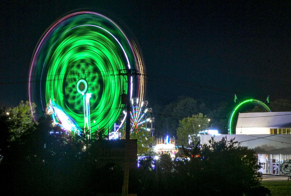 Lights on a ride at the Great Anderson County Fair appear blurred with an eight-second time exposure on the first day of the Anderson Sports and Entertainment Complex in Anderson, S.C. Thursday, May 2, 2024.