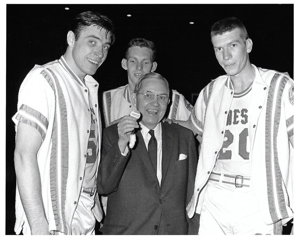 William B. Stokely Jr., middle, with Howard Bayne, Red Robbins and A.W. Davis after a game in the mid-1960s at Stokely Athletics Center. Stokely always carried his lucky rabbit's foot to the games.