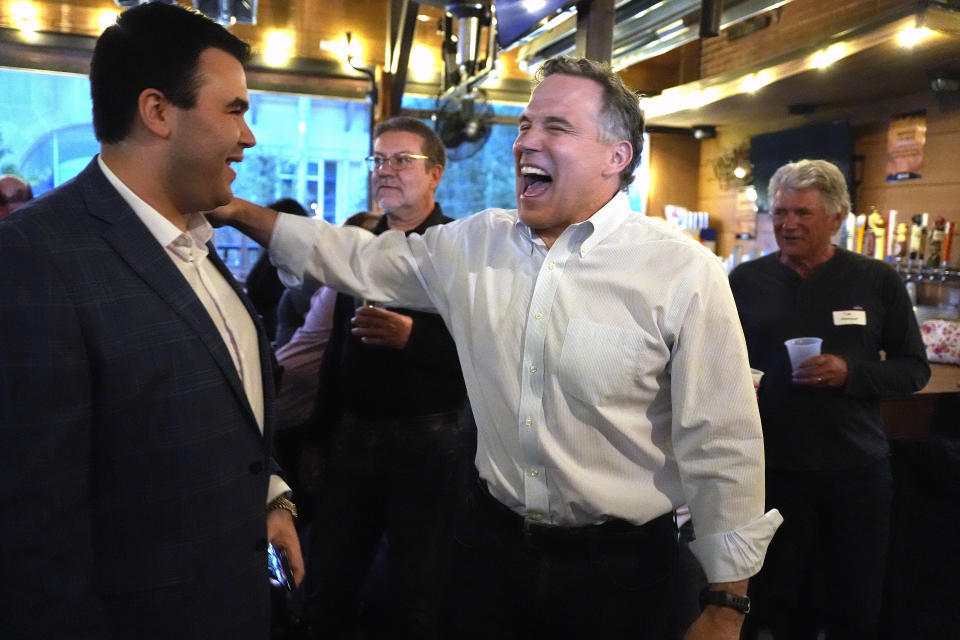 Republican David McCormick, center, making his second bid for a Pennsylvania U.S. Senate seat, greets supporters at his election night watch party in Pittsburgh, April 23, 2024. (AP Photo/Gene J. Puskar)