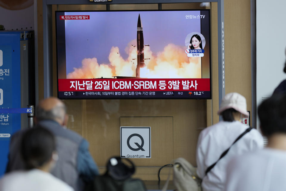 People watch a TV screen showing a news program reporting about North Korea's missile launch with file image, at a train station in Seoul, South Korea, Sunday, June 5, 2022. North Korea test-fired a salvo of multiple short-range ballistic missiles toward the sea on Sunday, South Korea's military said, extending a provocative streak in weapons demonstrations this year that U.S. and South Korean officials say may culminate with a nuclear test explosion. (AP Photo/Lee Jin-man)