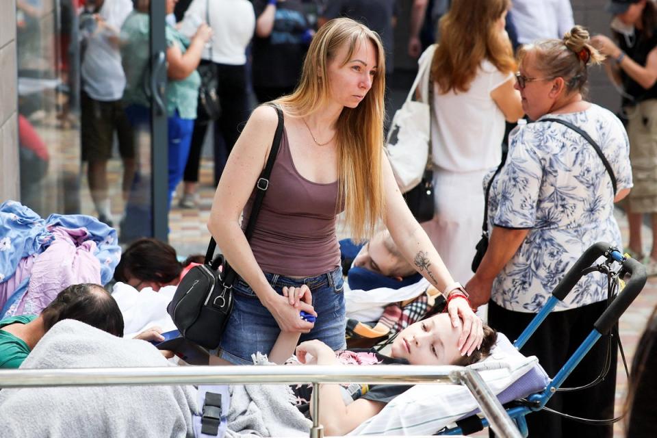 Children were wheeled off their wards and into the streets after the attack (Reuters)