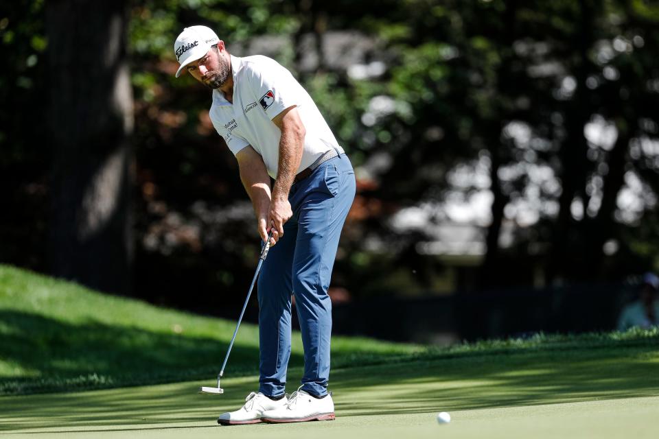 Cameron Young putts on the par-3 9th green, his final hole, during Round 2 of the Rocket Mortgage Classic at the Detroit Golf Club in Detroit on Friday, July 29, 2022. Young tied the course record with a 9-under 63.