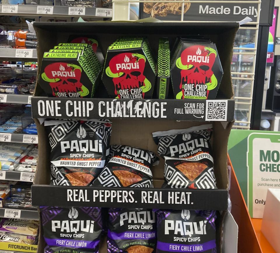 Paqui One Chip Challenge chips are displayed at a 7-Eleven store in Boston, Thursday, Sept. 7, 2023. The death of a Massachusetts teenager after his family said he ate an extremely spicy tortilla chip has led to an outpouring of concern about the social media challenge and prompted retailers to pull the product from their shelves at the manufacturer's request. The chips were removed from display on Friday, Sept. 8. (AP Photo/Steve LeBlanc)