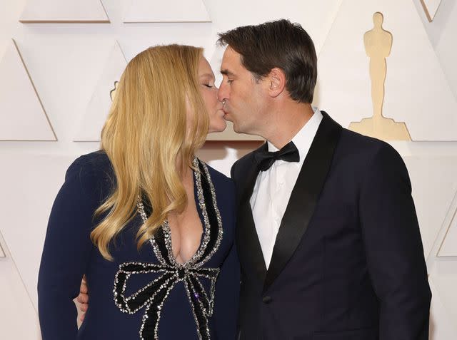 <p>Mike Coppola/Getty </p> Amy Schumer and Chris Fischer attend the 94th Annual Academy Awards at Hollywood and Highland on March 27, 2022 in Hollywood, California.