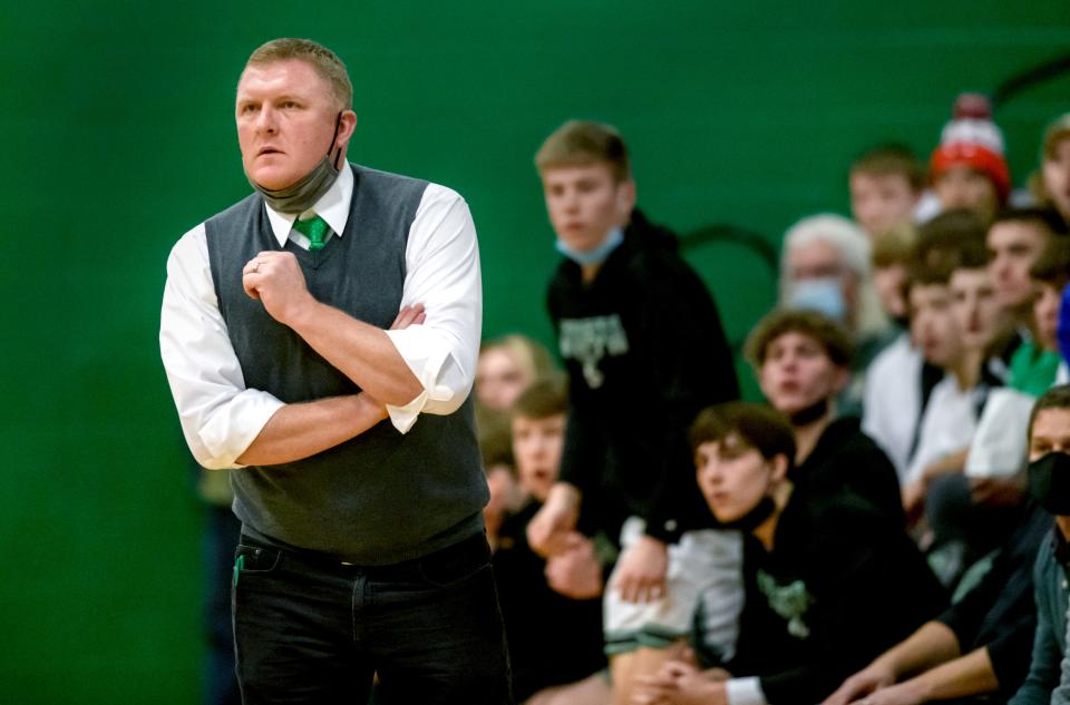 Eureka head coach Aaron Dohner keeps an eye on the action as the Hornets battle the El Paso-Gridley Titans in the first half Friday, Jan. 7, 2022 at Eureka High School. The Hornets fell to the Titans 55-46.