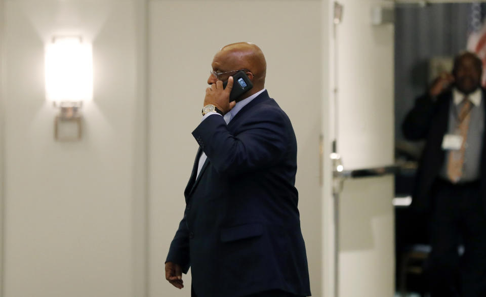 Acting Baltimore Mayor Bernard "Jack" Young talks on the phone outside the National Organization of Black County Officials annual Economic Development Conference, Thursday, May 2, 2019, in Detroit. Young became acting mayor on Thursday after Mayor Catherine Pugh resigned under pressure amid a flurry of investigations into whether she arranged bulk sales of her self-published children's books to disguise hundreds of thousands of dollars in kickbacks. (AP Photo/Carlos Osorio)