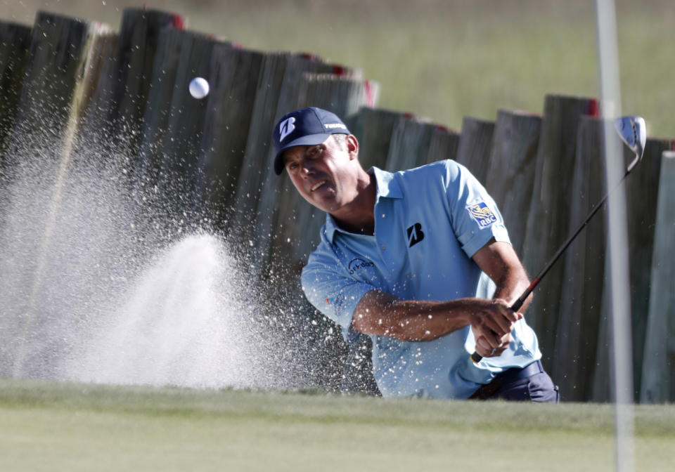 Matt Kuchar blast out of the sand on 17 during the final round of the RBC Heritage golf tournament at Harbour Town Golf Links on Hilton Head Island, S.C., Sunday, April 21, 2019. Kuchar came in second place at 11- under par. (AP Photo/Mic Smith)