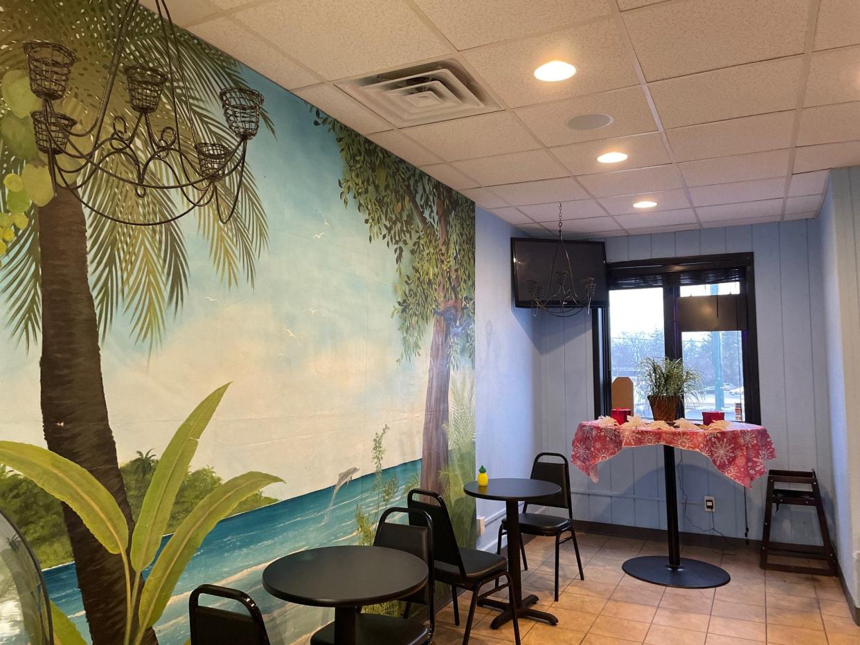 Juan Flores' mural occupies a prominent spot at Havana Cafe in Franklin.