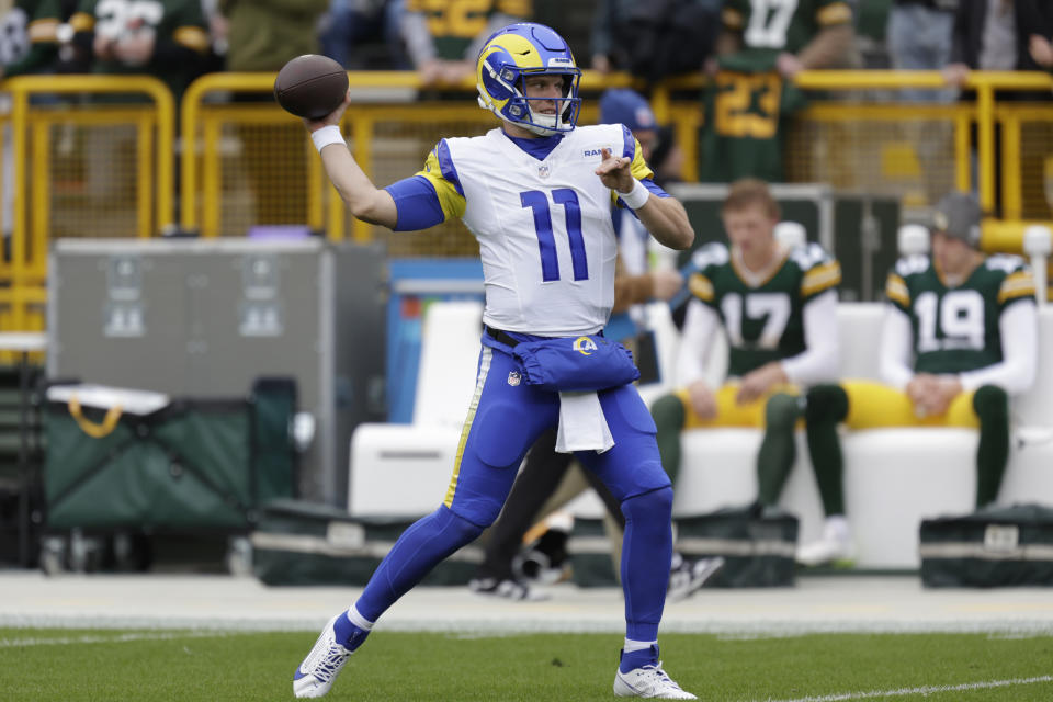 Los Angeles Rams quarterback Brett Rypien (11) warms up before an NFL football game against the Green Bay Packers, Sunday, Nov. 5, 2023, in Green Bay, Wis. (AP Photo/Matt Ludtke)