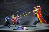 In this June 10, 2012 handout photo provided by the San Francisco Opera, Reneé Tatum, Lauren McNeese and Melody Moore as The Three Ladies and Alek Shrader as Tamino, are shown during a scene from the final dress rehearsal of "The Magic Flute." The San Francisco Opera's summer season includes a musically rousing rendition of Verdi's “Attila,” and a visually captivating take on Mozart's “The Magic Flute.” (AP Photo/San Francisco Opera, Cory Weaver)