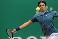 Swiss Roger Federer returns the ball to France's Jo-Wilfried Tsonga during their Monte-Carlo ATP Masters Series Tournament tennis match, on April 18, 2014, in Monaco