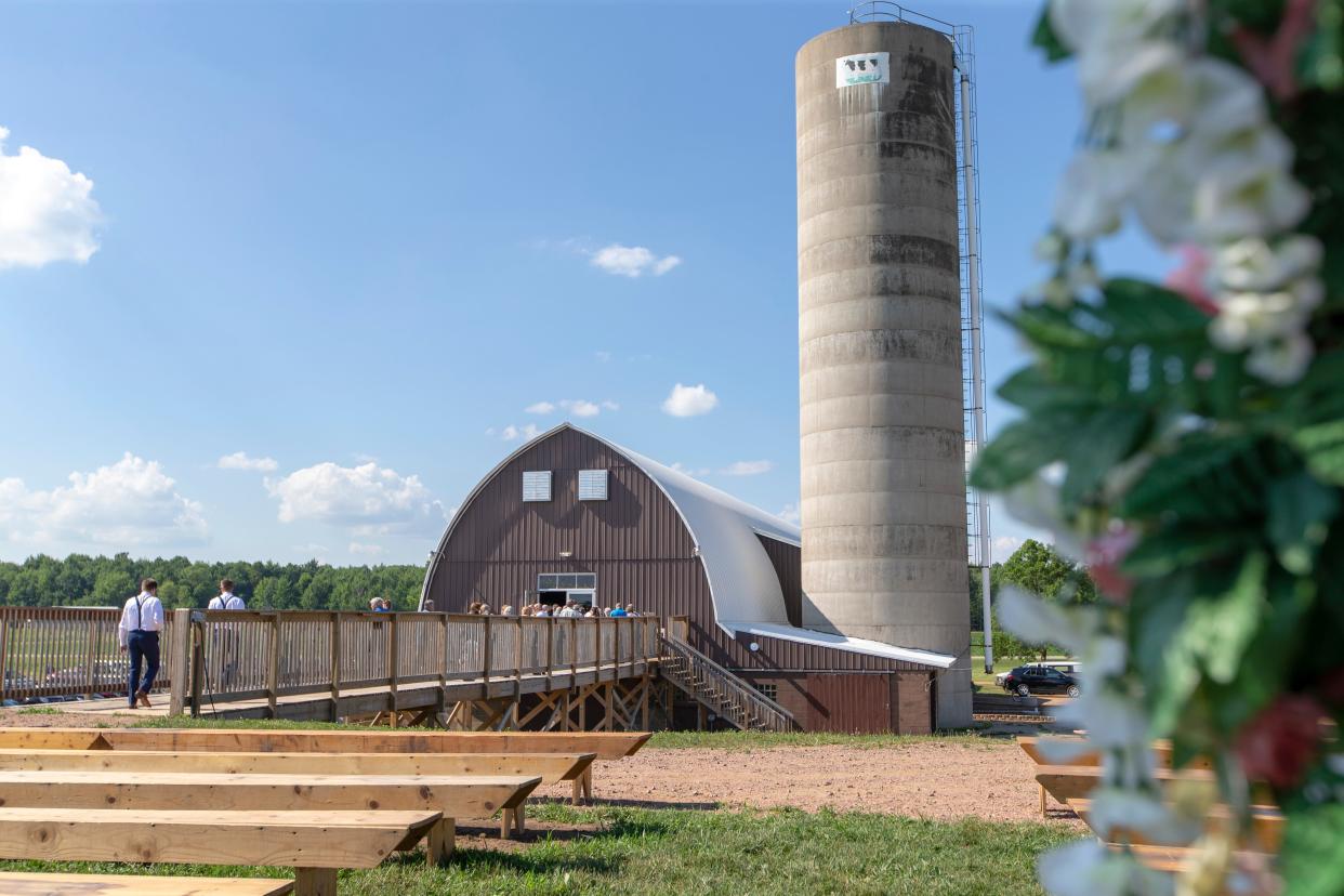 Wedding guests head into Eron's Event Barn in Stevens Point after an outdoor ceremony.