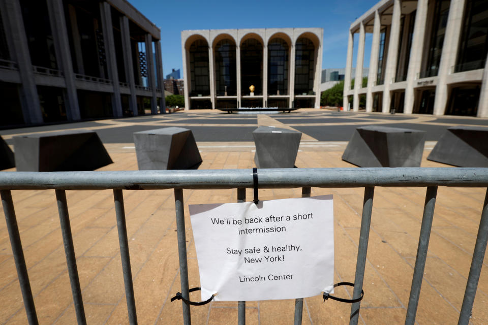 A sign is seen on a barrier at the closed and empty Lincoln Center in Manhattan during the outbreak of the coronavirus disease (COVID-19) in New York City, New York, U.S., May 21, 2020. REUTERS/Mike Segar