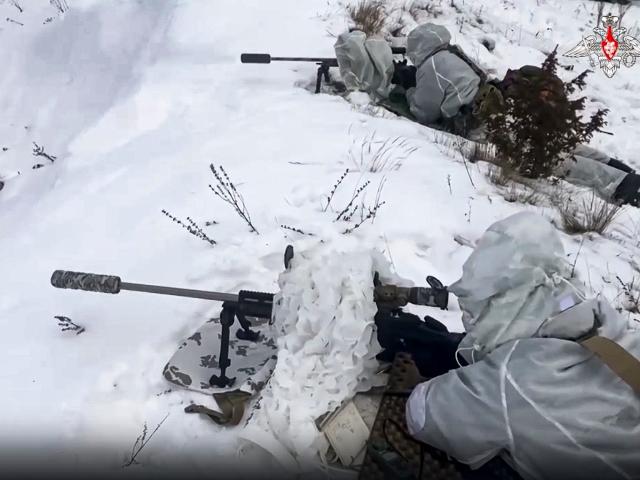 In this handout photo taken from video released by Russian Defense Ministry Press Service on Wednesday, Dec. 28, 2022, Russian soldiers take part in drills at an unspecified location in Belarus.
