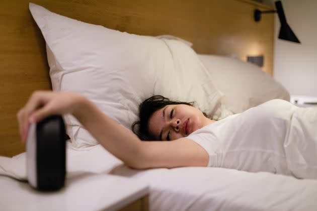 Stick to a regular wakeup time and don't stress about the bedtime quite yet. (Photo: rudi_suardi via Getty Images)