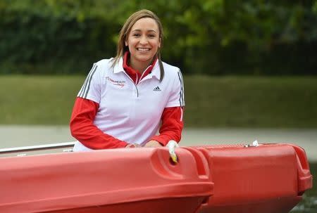 British Olympic champion heptathlete Jessica Ennis-Hill arrives in a boat at the Serpentine lake at Hyde Park in London September 11, 2013. REUTERS/Toby Melville