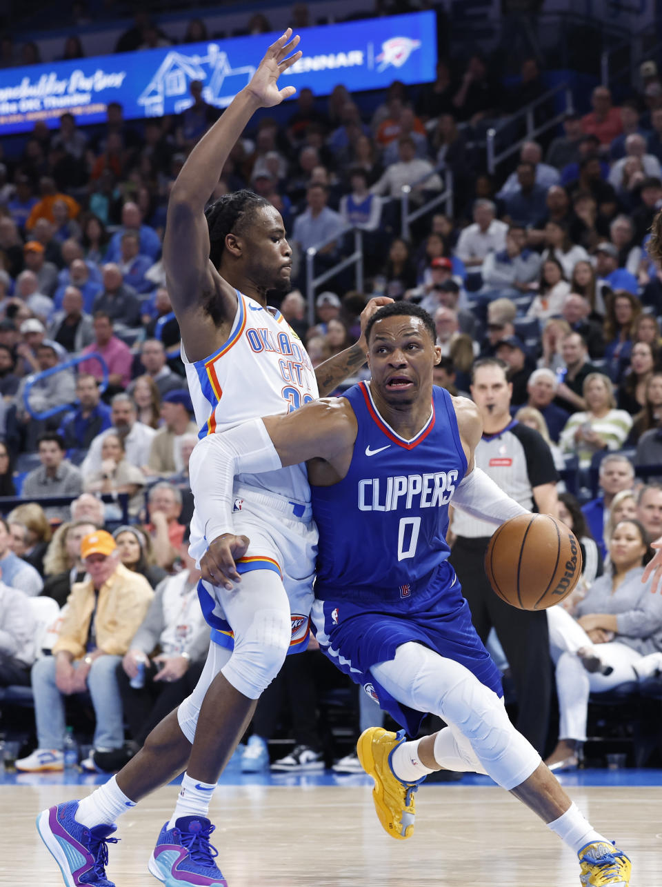 Feb 22, 2024; Oklahoma City, Oklahoma, USA; LA Clippers guard <a class="link " href="https://sports.yahoo.com/nba/players/4390/" data-i13n="sec:content-canvas;subsec:anchor_text;elm:context_link" data-ylk="slk:Russell Westbrook;sec:content-canvas;subsec:anchor_text;elm:context_link;itc:0">Russell Westbrook</a> (0) drives around Oklahoma City Thunder guard Cason Wallace (22) during the second half at Paycom Center. Mandatory Credit: Alonzo Adams-USA TODAY Sports