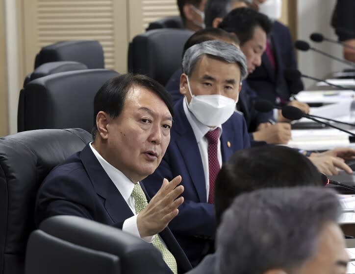 In this photo provided by South Korea Presidential Office via Yonhap News Agency, South Korean President Yoon Suk Yeol speaks during the National Security Council (NSC) meeting at the presidential office in Seoul, South Korea, Wednesday, May 25, 2022. North Korea test-launched a suspected intercontinental ballistic missile and two shorter-range weapons into the sea Wednesday, South Korea said, hours after President Joe Biden ended a trip to Asia where he reaffirmed the U.S. commitment to defend its allies in the face of the North's nuclear threat. (South Korea Presidential Office /Yonhap via AP)