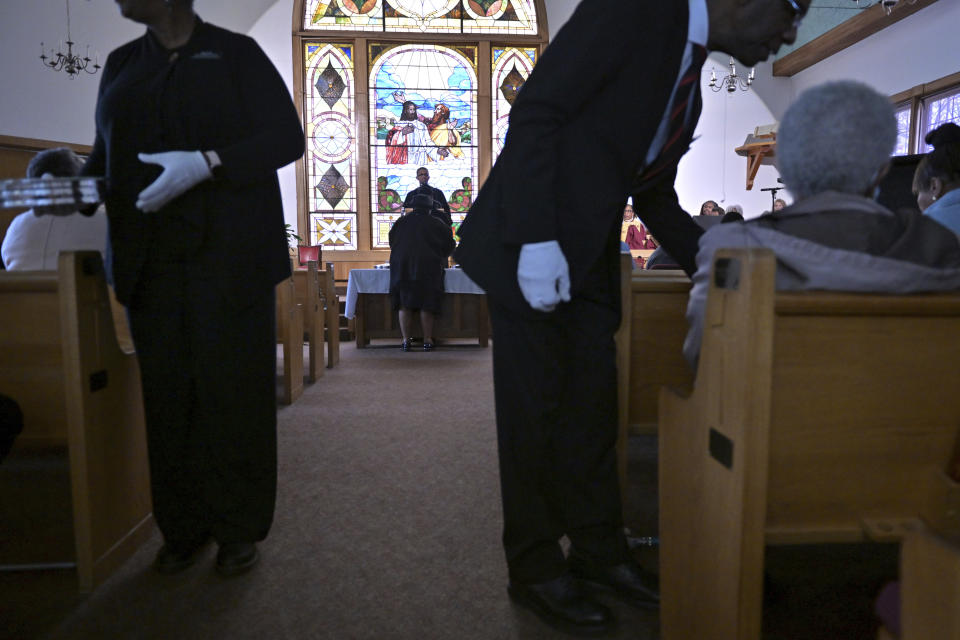 The Rev. Brandon Thomas Crowley, center, leads Sunday services at Myrtle Baptist Church in Newton, Mass., on Sunday, May 5, 2024. (AP Photo/Josh Reynolds)