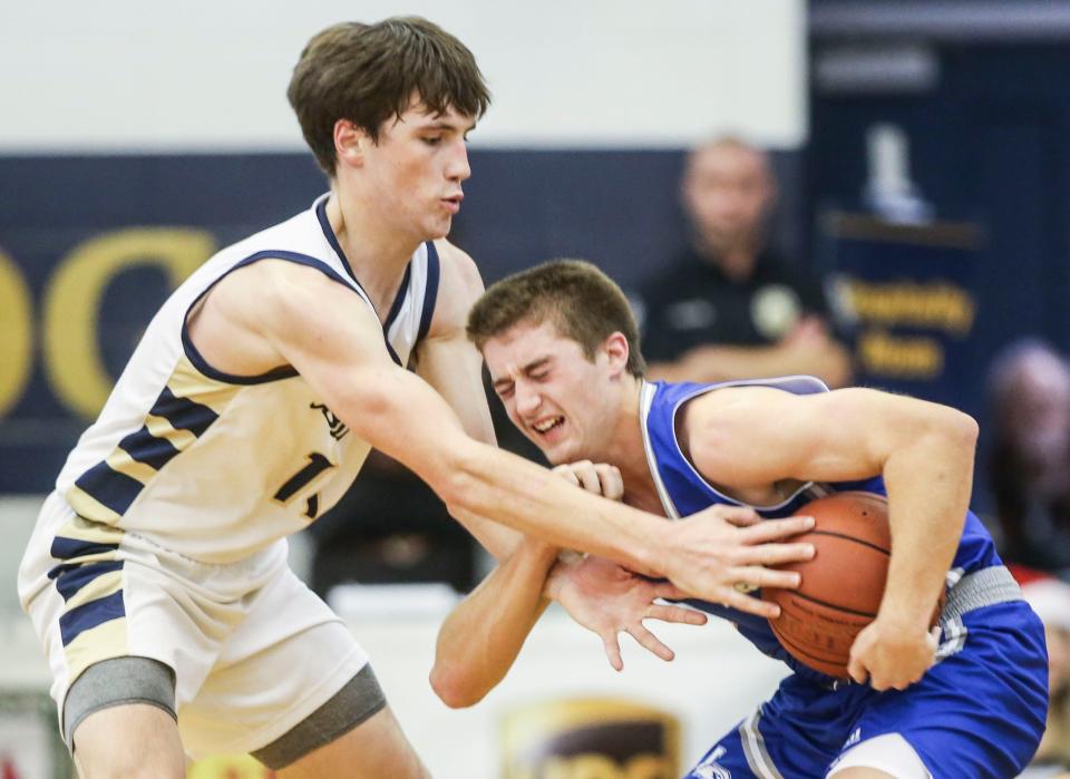 Fairdale's Dalton Hicks pressures LaRue County's Carson Childress at Friday's Chad Gardner Law King of the Bluegrass Holiday Classic. The Hawks beat the Bulldogs73-67. Dec. 16, 2022 