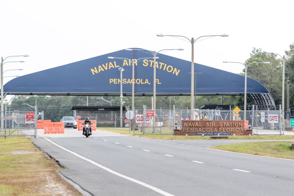 Traffic makes its way through the west gate at NAS Pensacola on Monday, December 9, 2019.