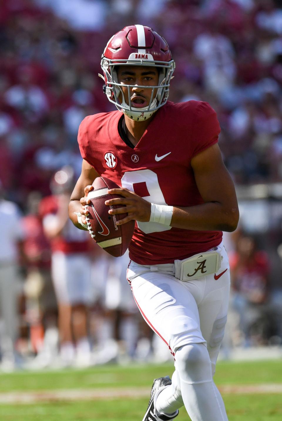 Sep 17, 2022; Tuscaloosa, Alabama, USA;  Alabama quarterback Bryce Young (9) rolls out as he looks for a receiver against Louisiana Monroe at Bryant-Denny Stadium. Mandatory Credit: Gary Cosby Jr.-USA TODAY Sports