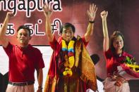 (From left) Khung Wai Yeen, Chee Soon Juan and Jaslyn Go wave to supporters after the rally. (Photo: Joseph Nair)