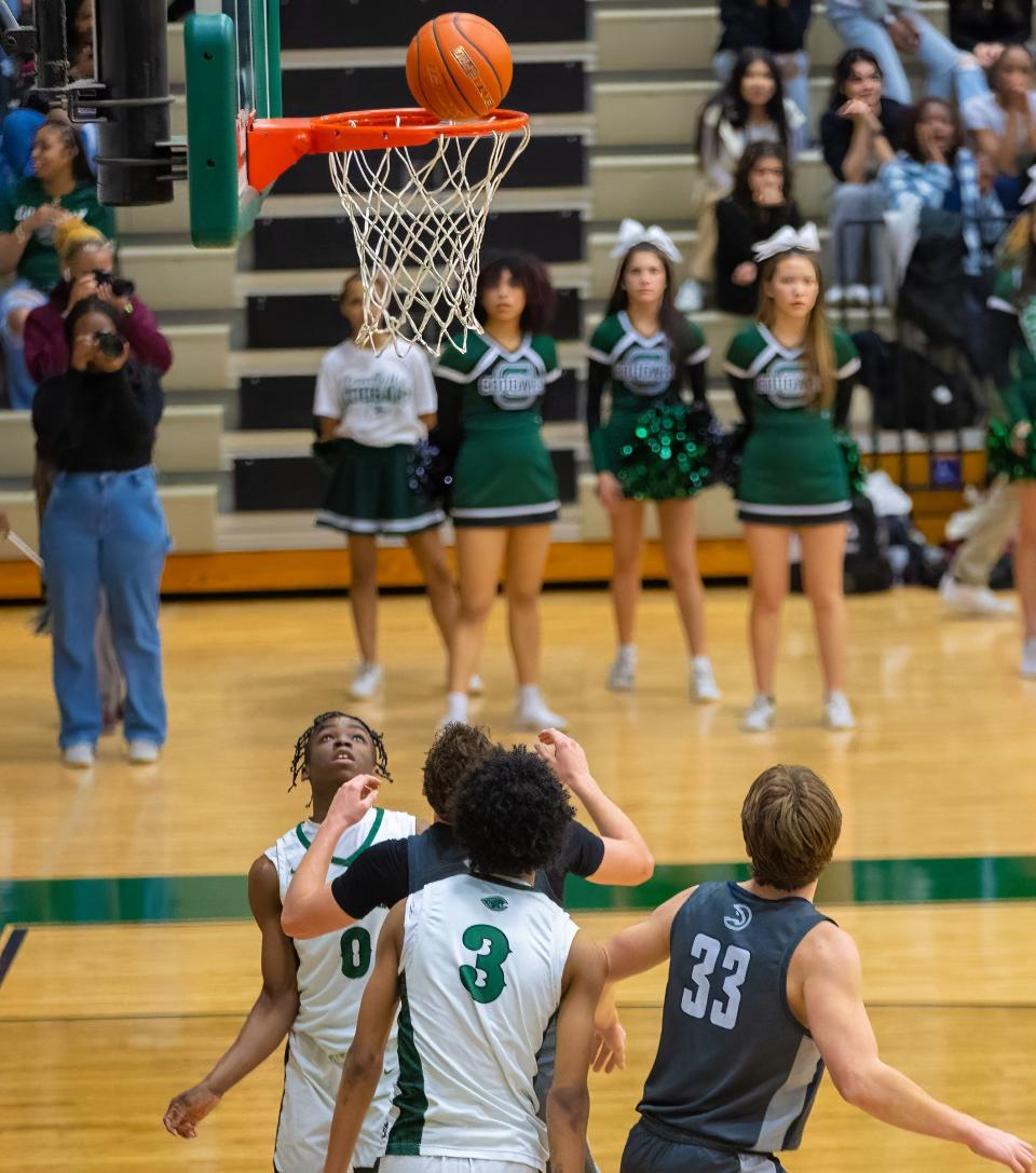 Connally guard Kendal White, back left, watches his shot go through in the fourth period. This was Connally's 17th straight win —  the longest active winning streak in Central Texas — and the Cougars can achieve an undefeated district season with a win Tuesday.