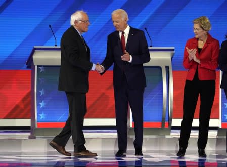 Candidates greet each other before the start of the 2020 Democratic U.S. presidential debate in Houston, Texas, U.S.