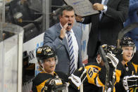 Pittsburgh Penguins head coach Mike Sullivan pulls his goalie during the third period of an NHL exhibition hockey game against the Columbus Blue Jackets in Pittsburgh, Monday, Sept. 27, 2021. (AP Photo/Gene J. Puskar)