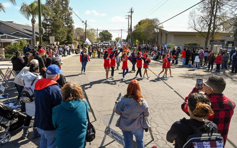 Parade-watchers line the streets around the Pinedale Community Center during Pinedale’s centennial celebration on Saturday, March 25, 2023. The community in north Fresno is celebrating the 100th anniversary of its establishment.