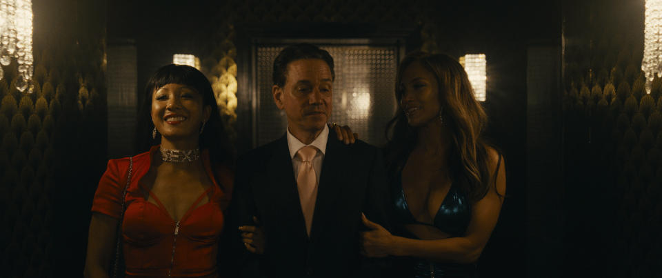 Constance Wu, some dude and Jennifer Lopez in "Hustlers." (Photo: STXfilms)