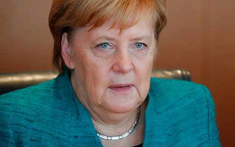 Angela Merkel is coming under pressure to act on immigration in the run-up to Bavarian elections - Credit:  HANNIBAL HANSCHKE/Reuters