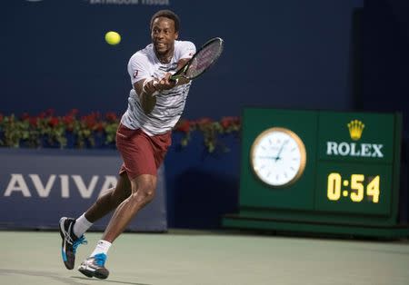 Jul 30, 2016; Toronto, Ontario, Canada; Gael Monfils of France attempts to return a ball during the singles semi final match at the Rogers Cup tennis tournament at Aviva Centre. Novak Djokovic of Serbia won 6-3, 6-2. Mandatory Credit: Nick Turchiaro-USA TODAY Sports