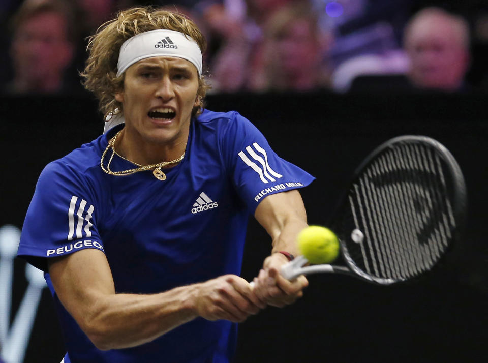 Team Europe's Alexander Zverev hits a return to Team World's Kevin Anderson during a men's singles tennis match at the Laver Cup, Sunday, Sept. 23, 2018, in Chicago. (AP Photo/Jim Young)