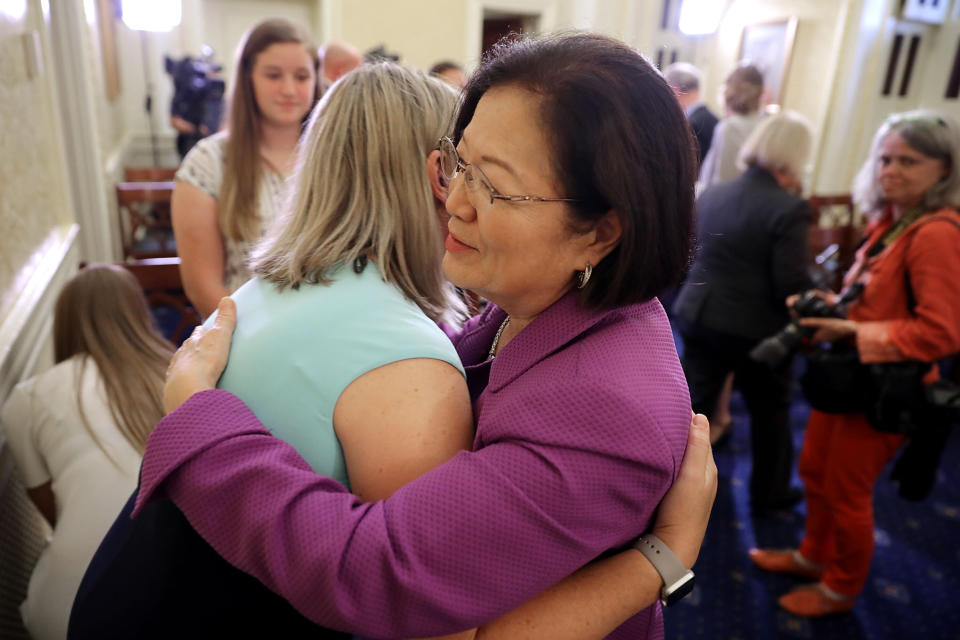 Sen. Mazie Hirono embraces Jill Hile of Hilliard, Ohio, whose daughter Allison lives with cystic fibrosis, following a news conference after the release of the GOP plan to replace Obamacare. (Photo: Chip Somodevilla/Getty Images)