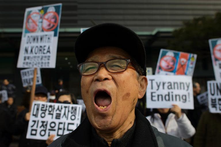 A conservative anti-North Korean activist shouts slogans during a protest in Seoul on Febraury 16, 2014 against the North Korean regime