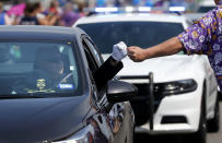 <p>A well-wisher gives a fist pump to a police officer as the funeral procession of East Baton Rouge Sheriff deputy Brad Garafola passes the scene, where Garafola and two Baton Rouge police were killed in Baton Rouge, La., July 23, 2016. (Photo: Gerald Herbert/AP)</p><p><br></p>