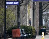 Northwestern football player Dan Vitale looks back at reporters and photographers as he walks into McGaw Hall, where voting is taking place on whether to form the nation's first union for college athletes, Friday, April 25, 2014, in Evanston, Ill. (AP Photo/Charles Rex Arbogast)