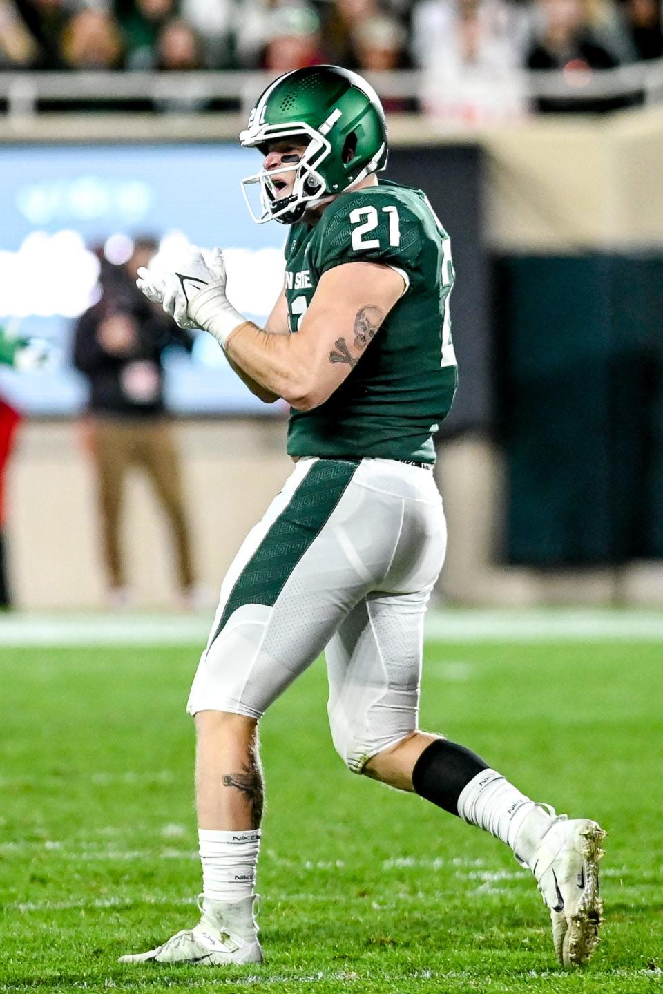 Michigan State&#39;s Chase Kline celebrates after making a stop against Nebraska during the third quarter on Saturday, Sept. 25, 2021, at Spartan Stadium in East Lansing.