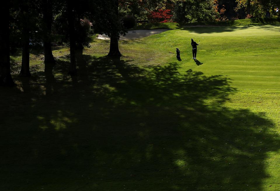 Kent Roosevelt's Liam Curtis takes his second shot at the Division I district golf tournament at Pine Hills Golf Club Monday.