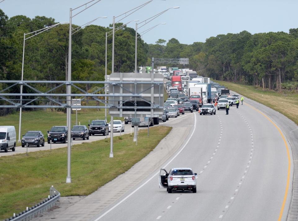 Southbound traffic is backed up Wednesday, Feb. 5, 2020, as Port St. Lucie Police close southbound I-95 at Gatlin Boulevard due to a reported shooting at a rest stop in Martin County.