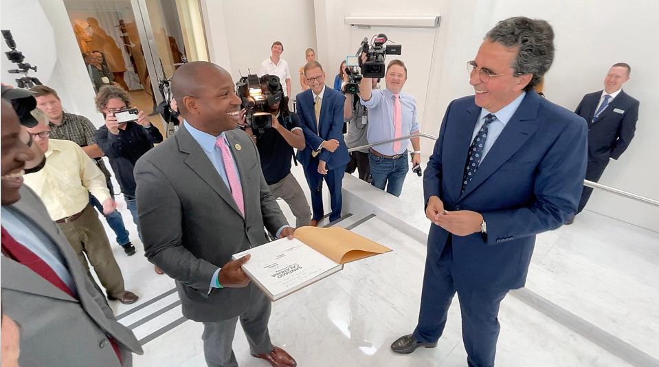 Mayor Cavalier Johnson, left, smiles as he’s presented with a signed copy of Santiago Calatrava’s book by Calatrava himself, who made a return to the Milwaukee Art Museum on Wednesday. The museum welcomed Santiago back to Milwaukee for the 20th anniversary of the opening of the Quadracci Pavilion, the Spanish architect’s first project in the United States.