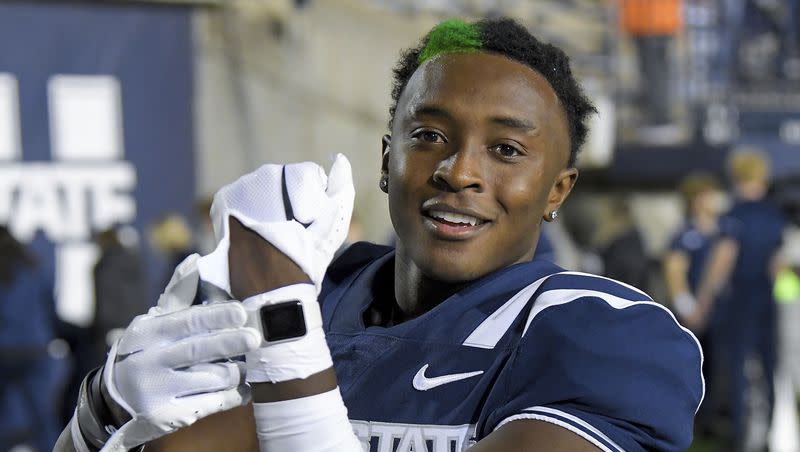 Utah State safety Ike Larsen celebrates the team’s win over Colorado State in an NCAA college football game Saturday, Oct. 7, 2023, in Logan, Utah. 