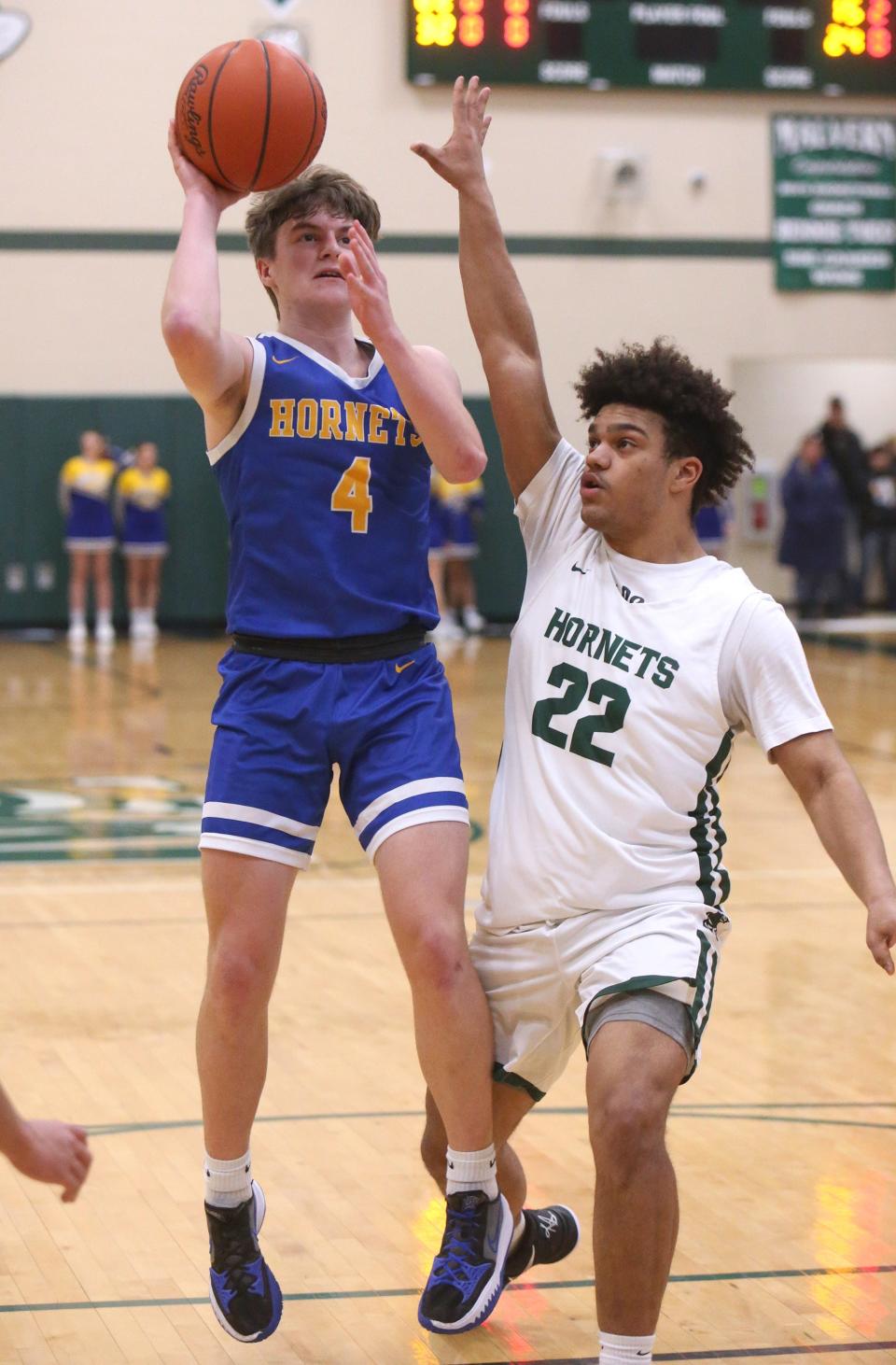 Luke Riley, 4, of East Canton takes a takes a shot while being guarded by Bryson White, 22, of Malvern during their game at Malvern on Friday, Jan. 28, 2022.