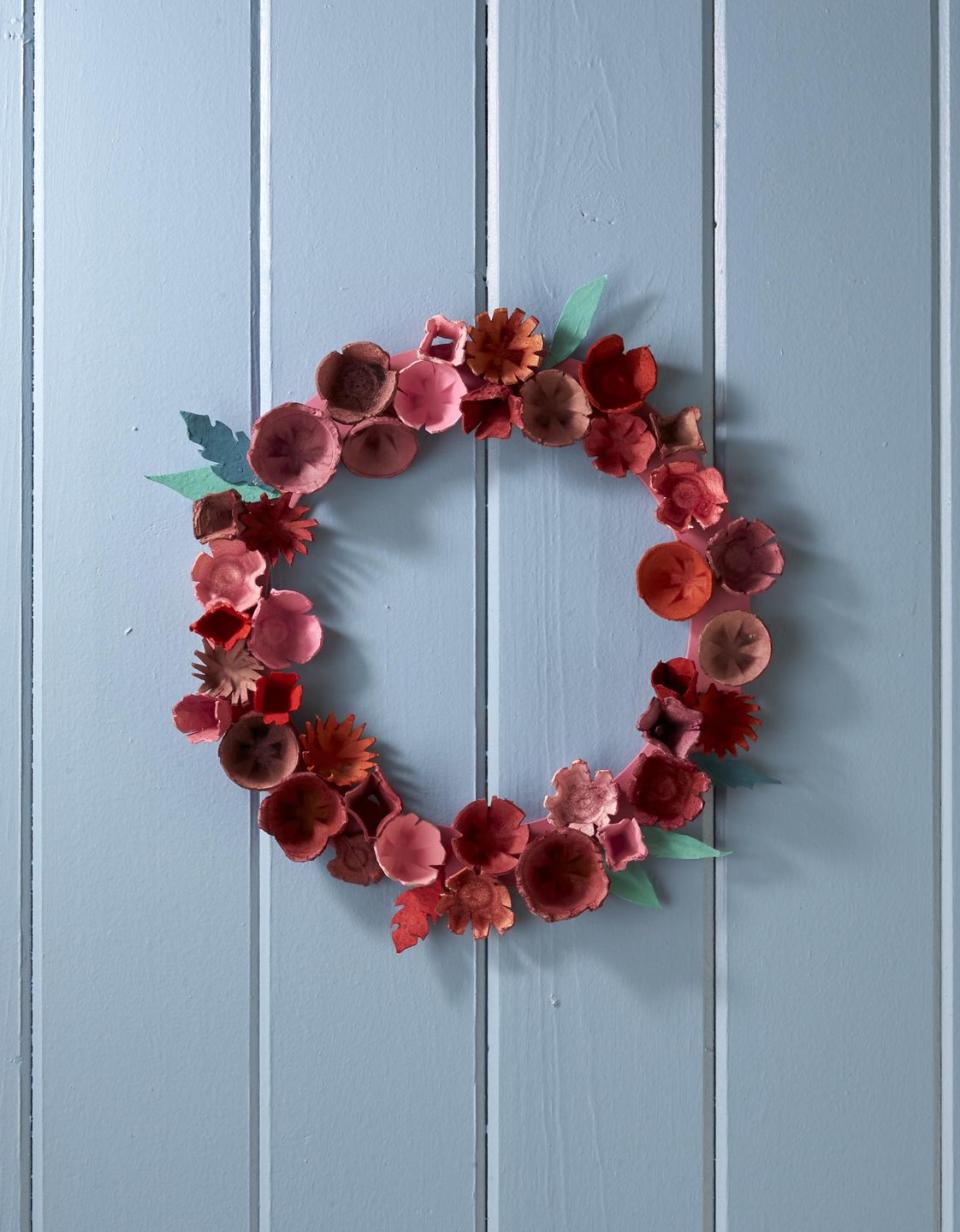 <p>Made from the common paper egg carton this wreath will look spectacular displayed on a covered door or over the mantel.</p><p><strong>To make:</strong> Cut individual egg cups from paper egg cartons. Notch and cut decorative edges with scissors. Dye or paint cups desired colors. Attach cups and craft paper leaves to a painted craft ring with hot-glue. </p><p><a class="link " href="https://www.amazon.com/Bright-Creations-Wedding-Floral-Natural/dp/B07Z8KDMBF/ref=sr_1_8?tag=syn-yahoo-20&ascsubtag=%5Bartid%7C10050.g.1111%5Bsrc%7Cyahoo-us" rel="nofollow noopener" target="_blank" data-ylk="slk:SHOP CRAFT RING;elm:context_link;itc:0;sec:content-canvas">SHOP CRAFT RING</a></p>