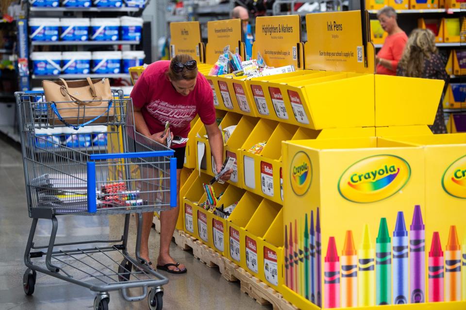 Customers browse through school supplies for sale at the Walmart on Parkside Drive in Turkey Creek, Tennesse in 2023 during Tennessee's annual sales tax holiday.